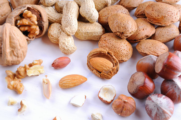 Nuts in shell and shelled on a table top view