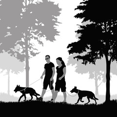 Couple walking with dogs