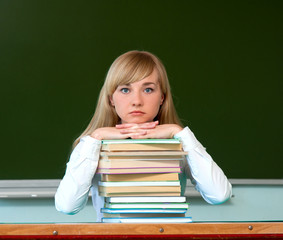 serious girl with school books