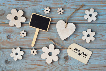 Wooden background with flowers and for you label