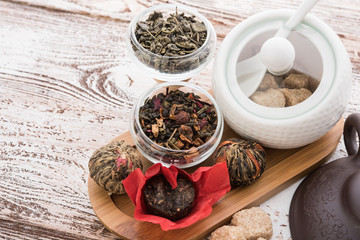 Tea cups with teapot on old wooden table