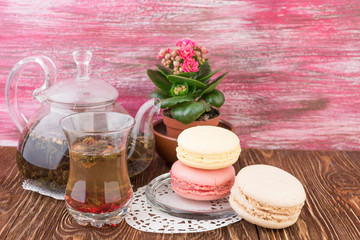 Fototapeta na wymiar exotic green tea with flowers in glass teapot