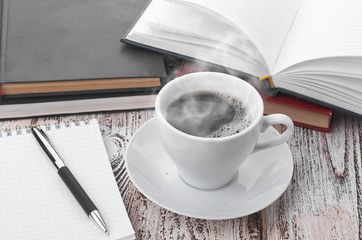 Cup of coffee on a wooden table