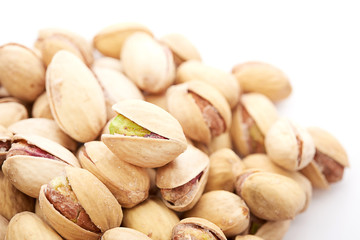 Heap of pistachios nuts isolated on the white