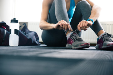 Woman tying shoelaces