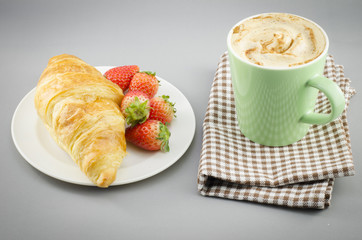 Breakfast with croissant,coffee and strawberry