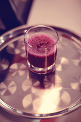 Red drink on glass