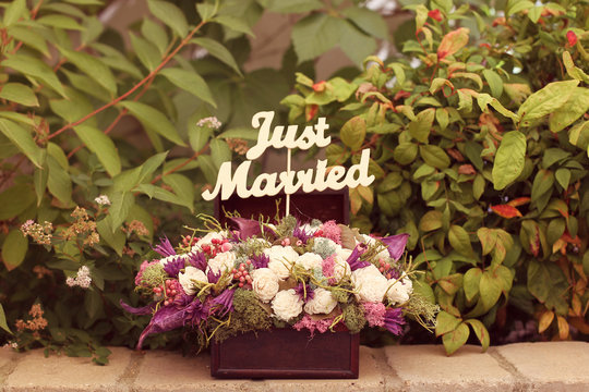 Just Married Sign In A Flower Bouquet