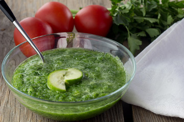 Cucumber gazpacho in glass bowl