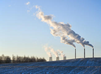 Winter landscape with factory chimneys