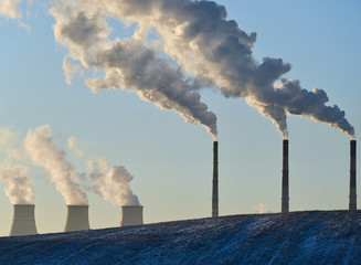 Winter landscape with factory chimneys