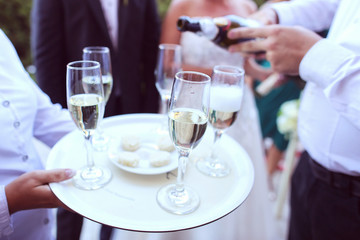 Waiter serving champagne