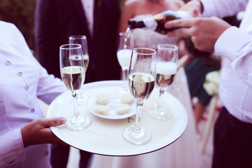 Waiter serving champagne