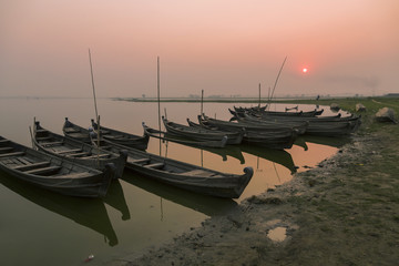 Fototapeta premium Wooden boats of fishermen at sunset