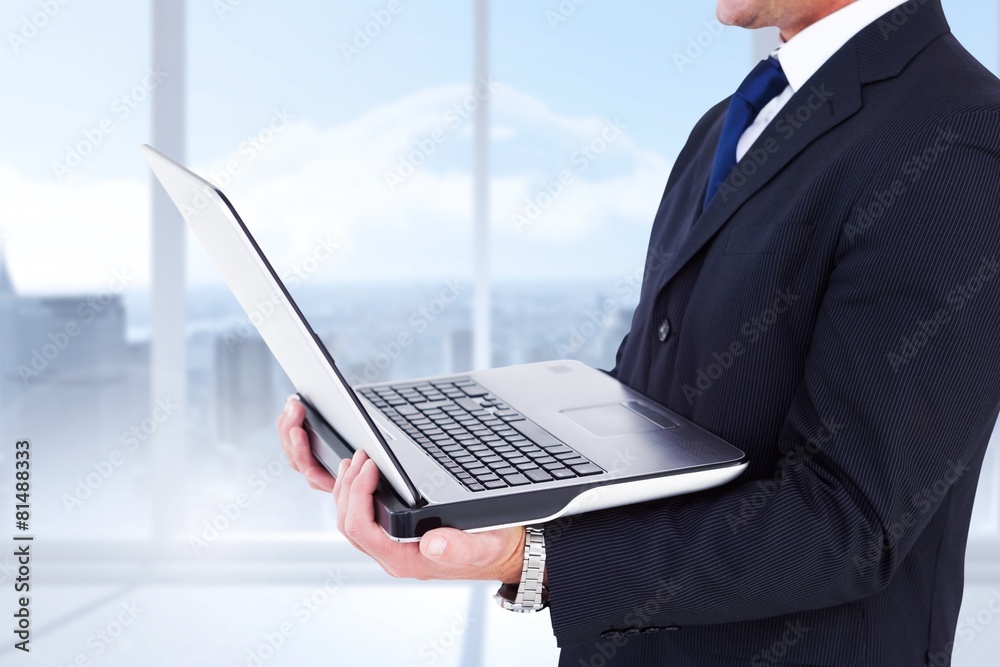 Poster Composite image of businessman with watch using tablet pc