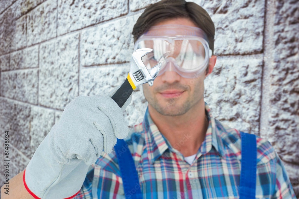 Poster composite image of plumber holding adjustable wrench