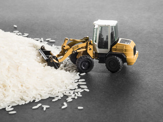 Spielzeugbagger, Reis, Weltmarkt, Verschwendung