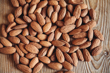 almonds on wooden surface