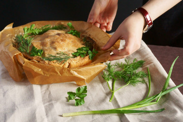 pie with greens cut with a knife hands