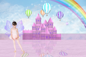 Little fairy balerina in front of a pink fairy castle © Dmitrii Kotin