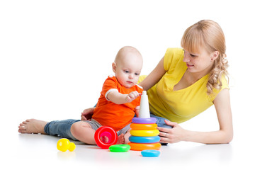 kid boy and mother play together with toy