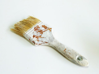 old dirty paintbrush on a white background