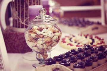 Delicious cookies and cakes on table
