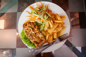 Cambodian fish barbeque with fries