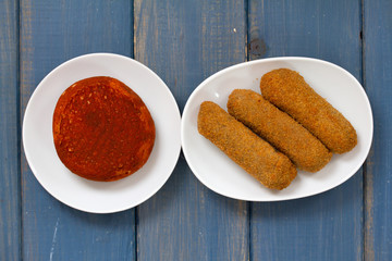 meat croquete on plate and cheese
