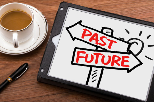 past or future on signpost hand drawing on tablet pc