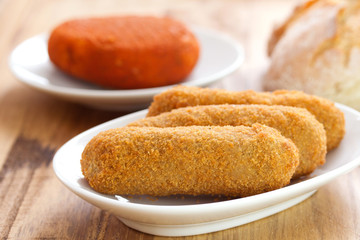 meat croquete on white dish