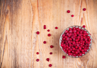 Frozen red currant berries in a glass bowl