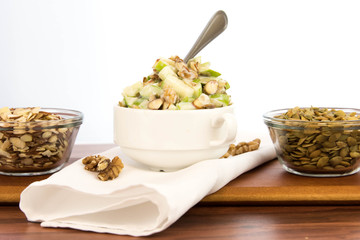 apple salad with almonds, walnuts and pumpkin seeds