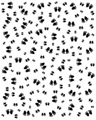 Seamless pattern with black silhouettes of footprints of baby