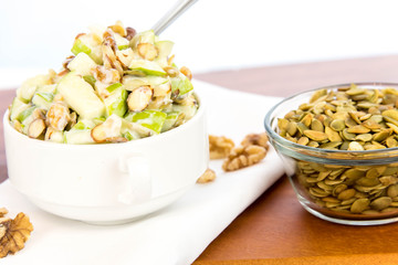 apple salad with almonds, walnuts and pumpkin seeds