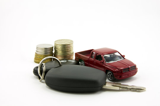 Car keys and toy car  and money