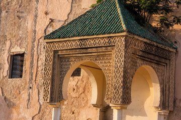 hood ornament on the walls of the medina of Meknes, Morocco