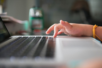 Little hand touch on keyboard notebook