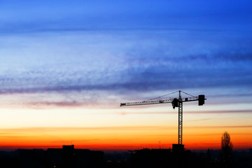 buildings under construction with sunset