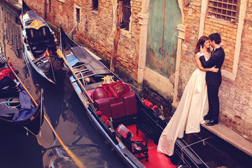 Bride and groom embracing in Venice