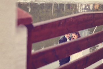 Bride and groom near lake