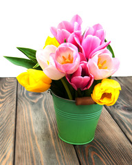 Bucket with colorful tulips