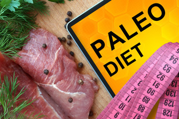 Tablet with Paleo diet and Fresh Meat