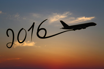 New year 2016 drawing by airplane on the air at sunset