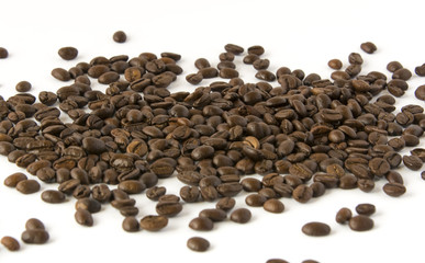 Roasted coffee beans on a white background