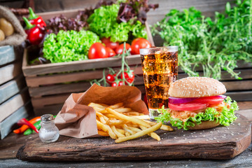 Fresh hamburger with fries and cold drink