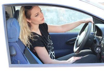 beautiful woman driving a car