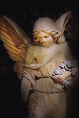 Vintage image of a sad angel on a cemetery