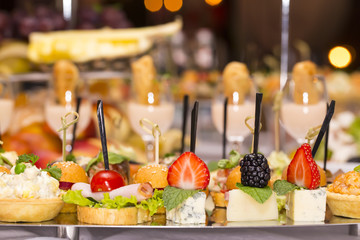 Canapes of cheese vegetables meat and seafood