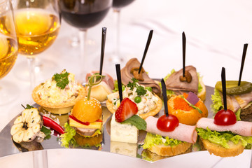 Canapes of cheese vegetables meat and seafood